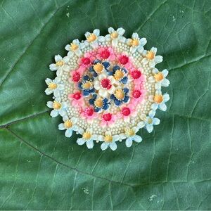 Vintage celluloid round flower pin Japanese